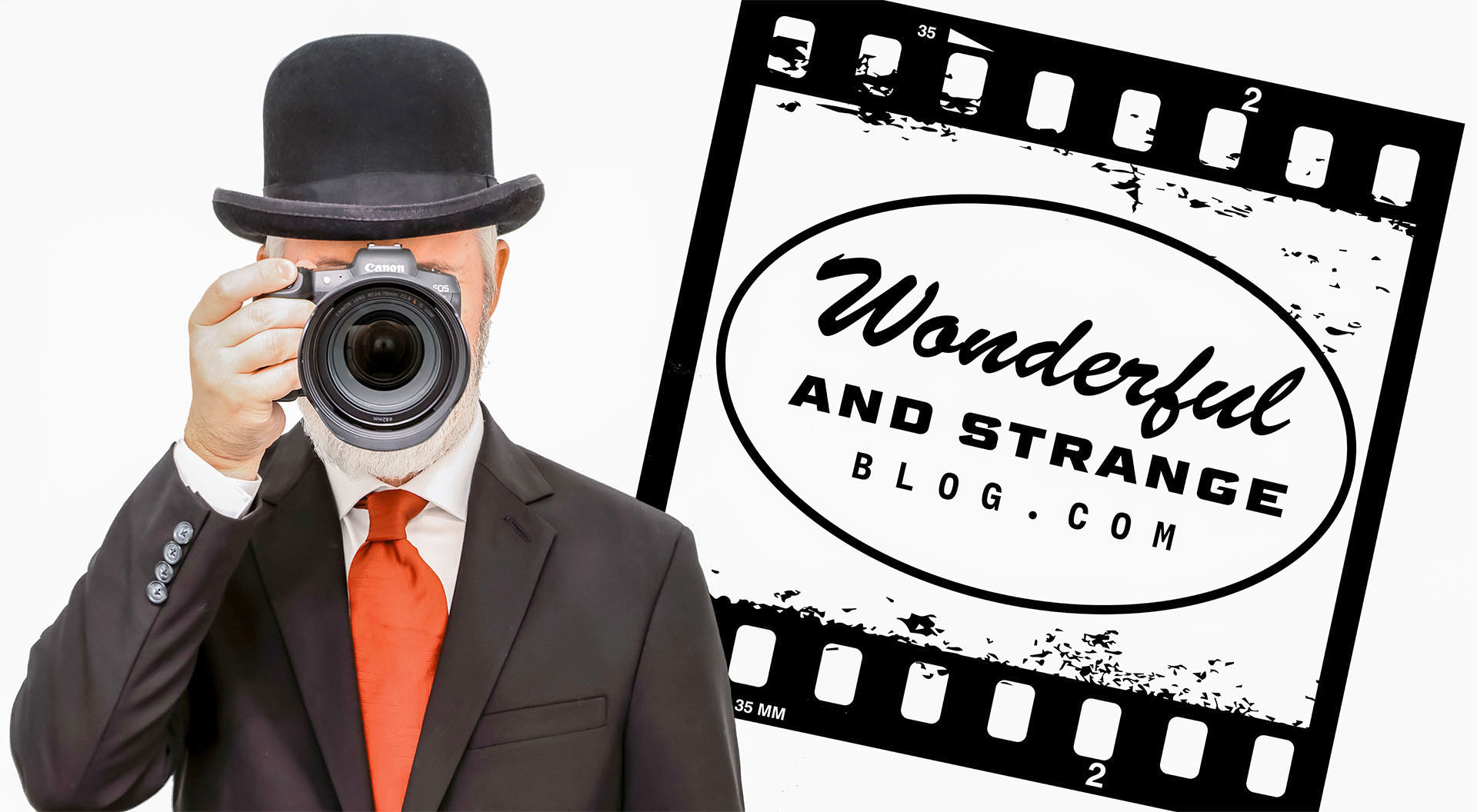 Guy in a black suit and bowler hat holding a camera obscuring his face